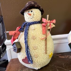 Stuffed 13” weighted snowman with bird house.
